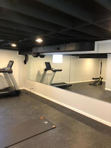 This full-size gym was completed by The Basement Guys with ease! They were able to prep the floor for the flooring company to install the gym floor.