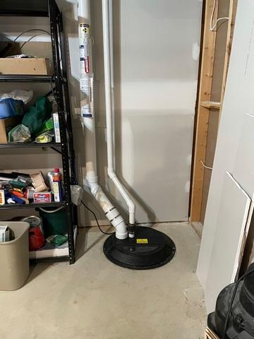 Our crew drilled a hole into the sump pump to form a suction point to get the radon from underneath the ground.