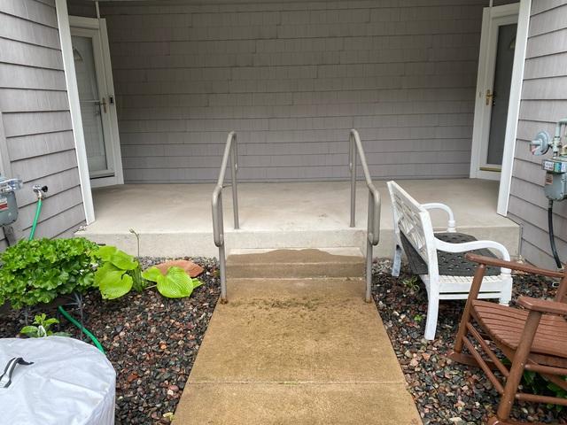 Our concrete repair team injected PolyLevel® beneath the slab to fill the voids and lift the walkway back to level.