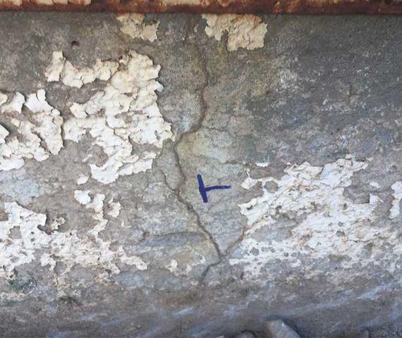 Symptom of Stem Wall Failure: Vertical Concrete Cracks