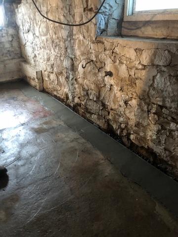 WaterGuard is installed below the floor slab and rests on top of the foundation footing. This system will collect water that seeps in from the walls and floors and direct the water towards the sump pump