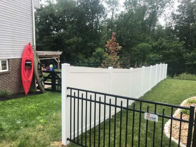 6' White Vinyl Acadia Privacy Fence and Black Aluminum Wilmington Rail Pickets Flush Bottom Commercial Grade Fence Installation with Rainbow gates