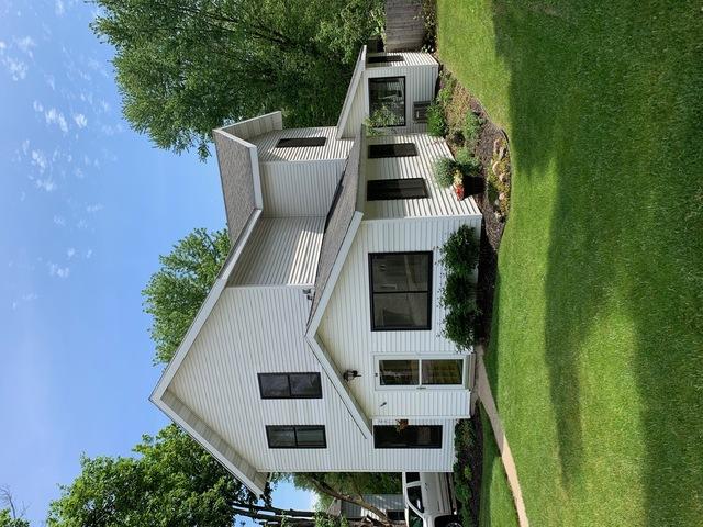 Took out all the existing old wooden windows and frames down to the rough
opening replaced with new vinyl windows, Black exterior and white interior
new trim on the inside, jambs, casings, stools and custom trim design