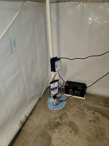 We replaced the old sump pump with a SmartSump sump pump. This is a closed system that keeps moisture from escaping once collected in the pump. We also lined the walls with a CleanSpace vapor barrier to prevent water vapor from collecting in the air from the brick walls. And we also installed a WaterGuard track along the floor to collect moisture from underneath the vapor barrier and lead it to the sump pump.