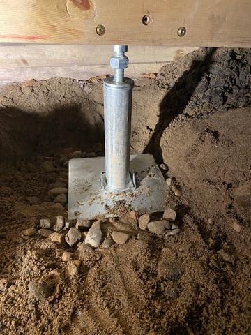 SmartJacks permanently lifted and stabilized the existing beams and floor joists in this crawl space