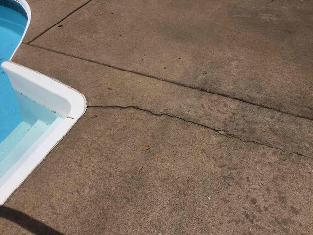 Cracked concrete pool deck