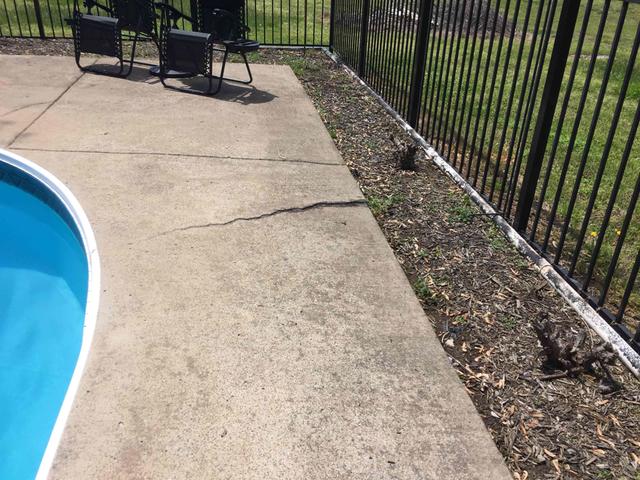 Cracked concrete pool deck