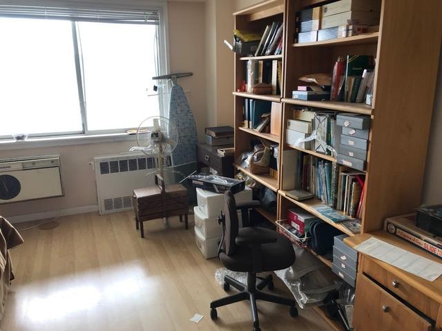 Spare bedroom ready for decluttering in an apartment in Kingsbridge, Bronx, NY.