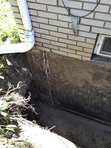 The foundation wall was covered in cracks that went from the inside to the outside. This crack even extended from the floor to the ceiling of the basement.