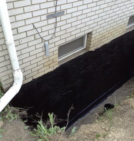 Step 1 to waterproofing basement walls from the outside.