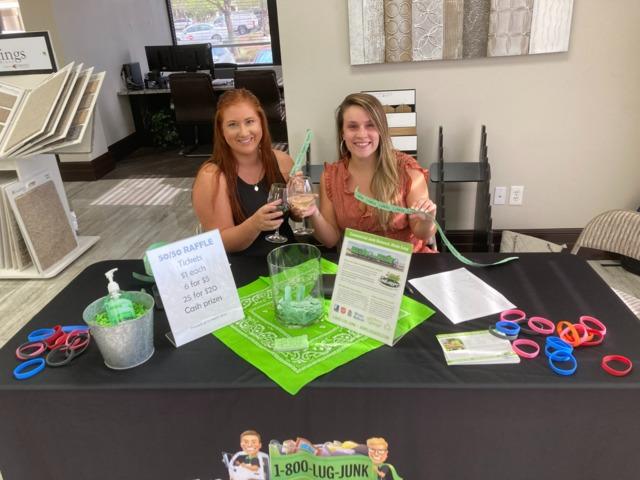 Hannah and Bethany helping with check in and the 50/50 raffle