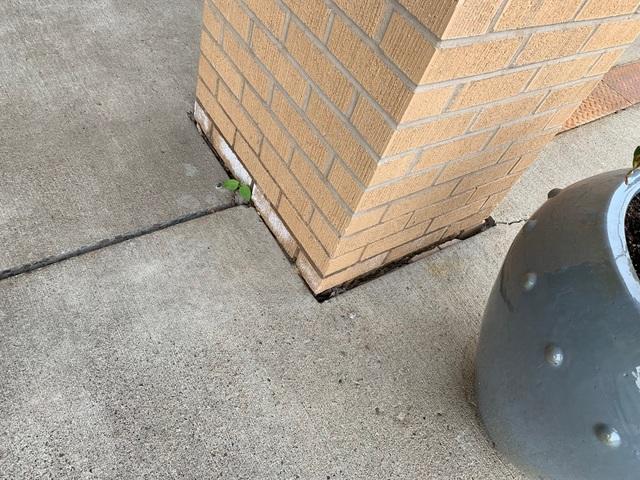 Concrete issues begin with soil movement beneath the slab. Gaps like these around the pillars allow water to easily reach the soil beneath the surface and contribute to washout.