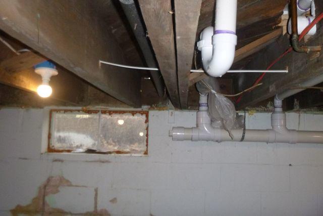 These beams that support the floor above are uneven. The one closest to the pipe looks as though it might be dipping. These beams being uneven result in uneven floors upstairs and could get worse if not supported.