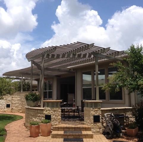 Custom Roma Style attached Pergola with a fixed and slotted roof