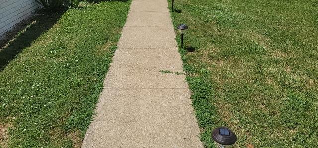 Uneven concrete sidewalk