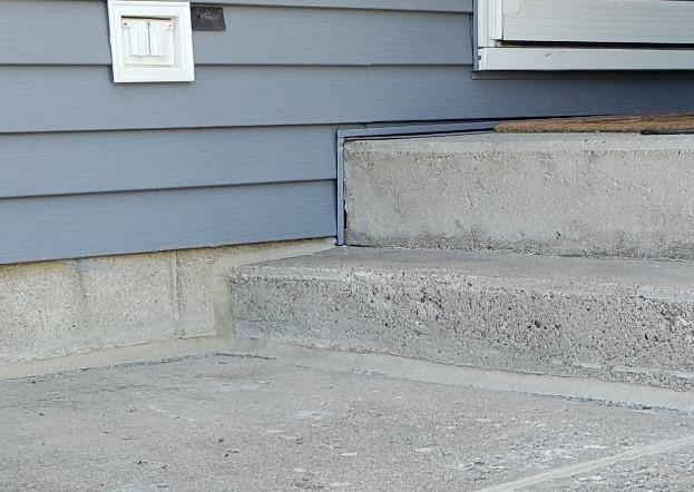 The corner of the homeowner's concrete step after the installation.