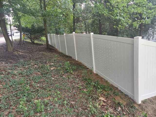 5' Khaki Vinyl Acadia Privacy Fence on backyard
