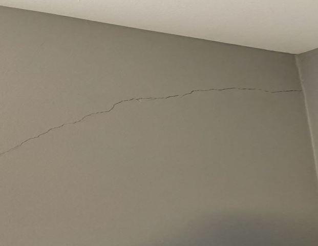Symptom of Foundation Stress: Wall Crack on Living Room