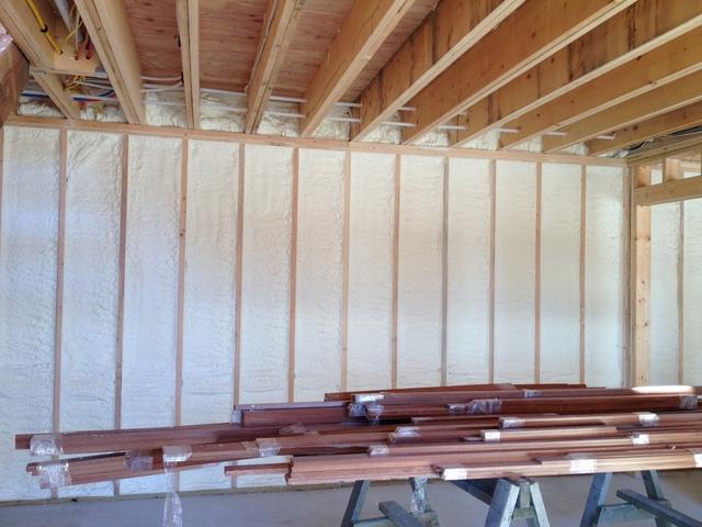 We sprayed closed cell up against the basement walls to act as a Vapor Barrier and also as Insulation inside the walls