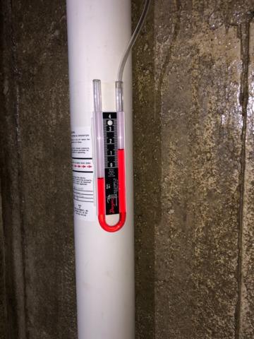 Ideal reading on our U-tube manometer post-install showing great air flow from our low voltage radon fan