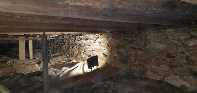 Although there was a very thin barrier on the floor, many areas of this dirt floor crawl space were not covered at all. This was allowing the earth's moisture to rise into the crawl space and raise the relative humidity, contributing to the mold and mildew.