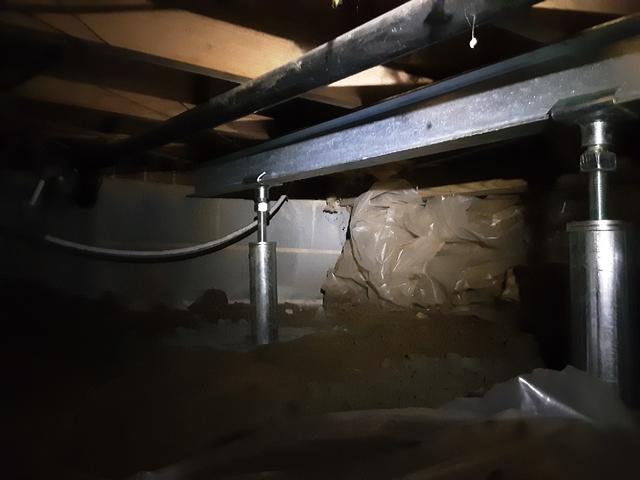 We attached a steel beam across the crawl space to provide a more durable pressure point.