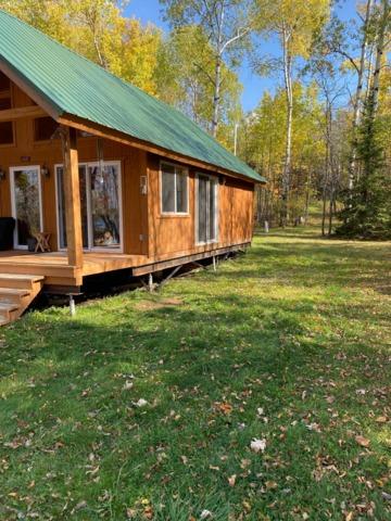 Cabin Supported with Supplemental Beams and Piering