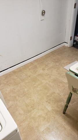 The laundry area is nearly finished. Our Installation Crew is finishing installing the trim that acts as a kick plate around the bottom of the walls.