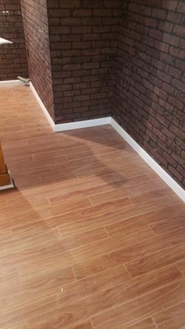 The old, brick finished wall combines well with our newly installed Thermal Dry Elite Plank Flooring. The look together really elevates the basement to an elegant urban look.