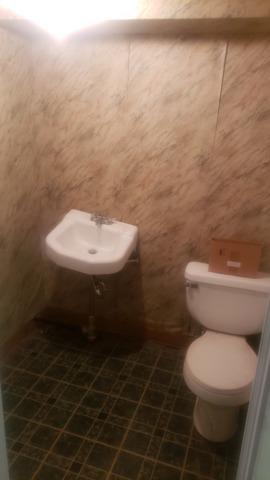 Before photo of the homeowner's original basement bathroom.