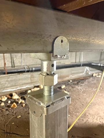 Support jacks were installed in the crawl space to shore up sagging joists and beams.