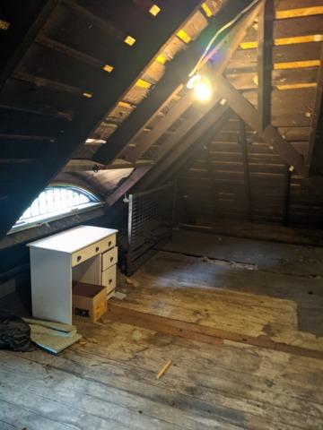 Vaulted attic ceiling lacking insulation in Peoria, IL