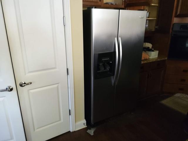 <p>Broken refrigerator to be removed from mom's house.</p>