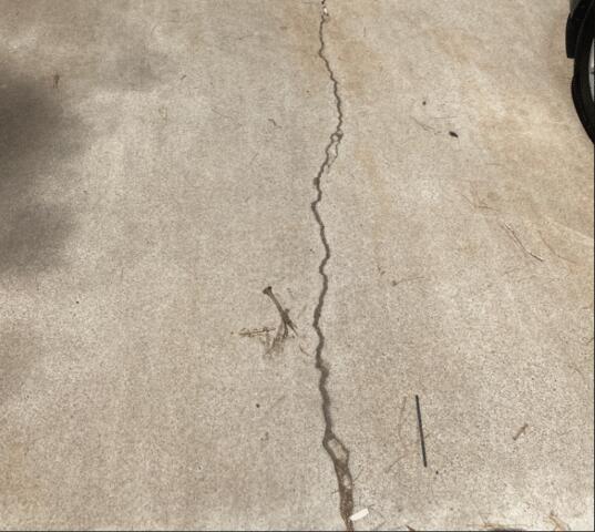 Symptom of a Settlement Foundation Problem: Concrete Cracks