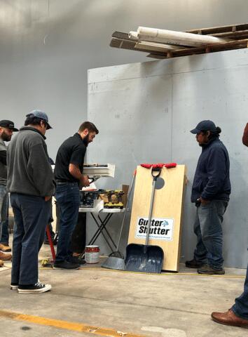 Gutter Shutter Instructor Showing The Crew