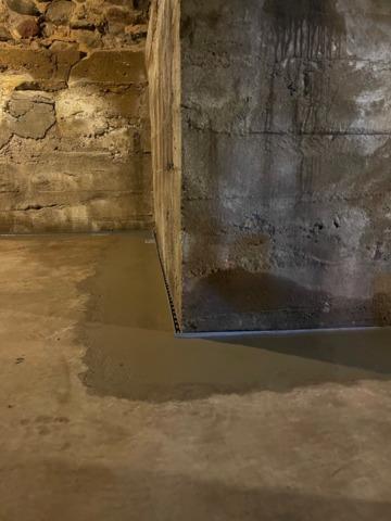 Our crew completed the project by applying a new layer of concrete over it and ensuring the basement was nice and clean.