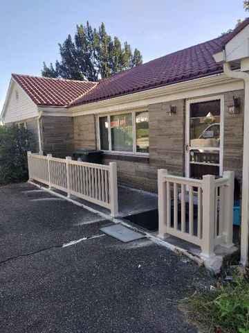 Almond Vinyl Superior T Railing Front Porch Installation