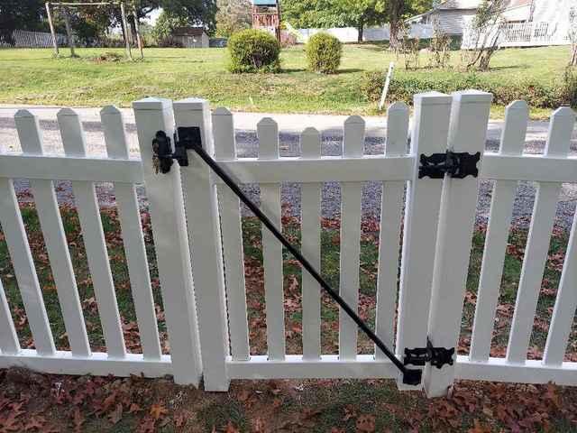 4' White Vinyl Olympic Concave Fence New England Caps, (1) 3' gate, (1) 6' double gate Installation