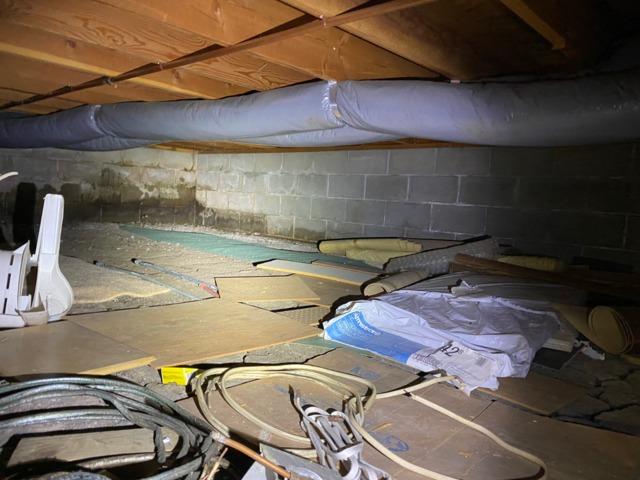 Damp dirt crawl space