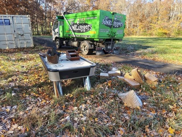 This air hockey table, household decor, boxes, and magazines, etc., had all been sitting outside for a while. We quickly loaded this up into the truck and proceeded on to the rest of the items.