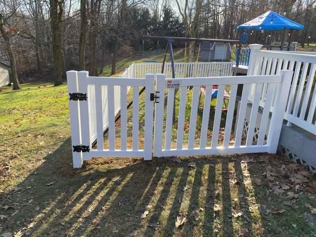 42" White Biscayne Vinyl Fence (1) 3' gate / (1) 5' gate in Backyard