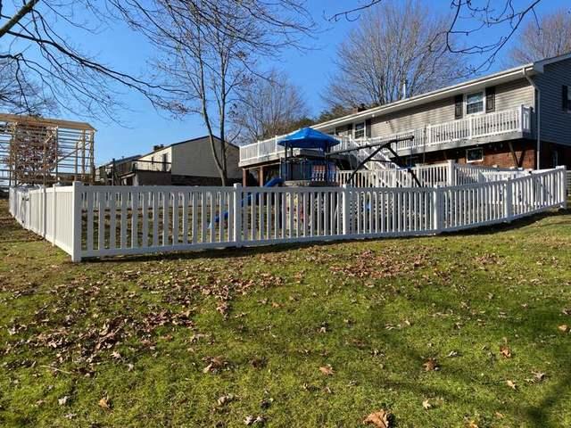 42" White Biscayne Vinyl Fence (1) 3' gate / (1) 5' gate in Backyard