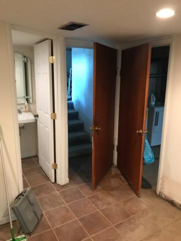 Water damaged walls, doors and floor
