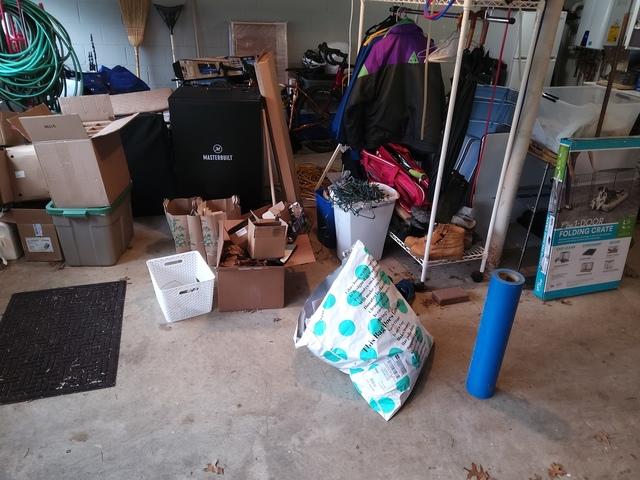 In addition to the kennel and carpet protector roll, there were cardboard boxes and packing materials (not pictured) we removed from our customer's garage.