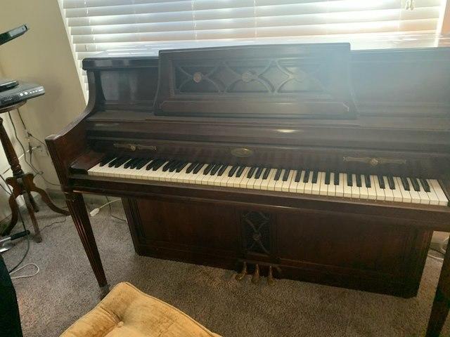 The Junkluggers of Atlanta Metro East hauling away a piano from the home of a customer in Tucker, GA.