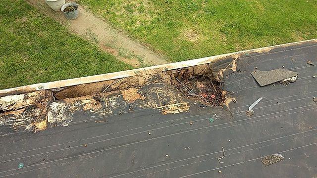 This is during the old roof tear-off, exposing damaged decking that will be replaced.