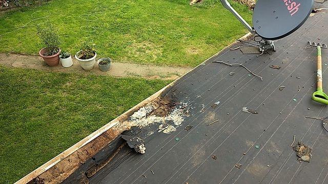 This is during the old roof tear-off, exposing damaged decking that will be replaced.