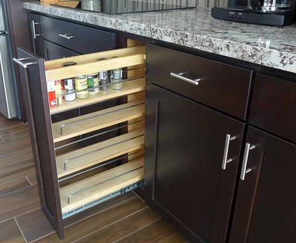 Spice rack cabinet. We love this! No more double stacking on a Lazy Susan in some hard-t-reach space where they fall over every time you try to find something.