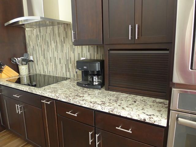 The countertop garage keeps some of the less attractive necessities out of sight.
