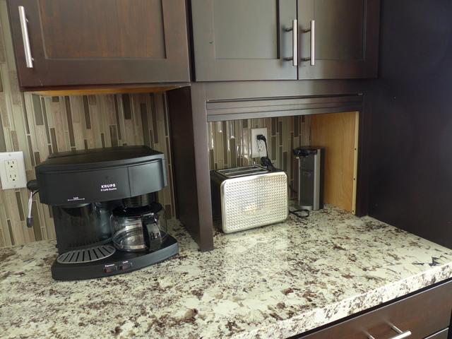 Handy countertop garage is a good place for things like coffee grinders and toasters.
